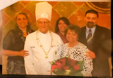 A family photograph framed with the jacket: Hans B. Nadler in chef’s whites and toque, standing with four family members.